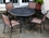 Alfresco Pilot All Weather Wicker Dining Set With 48" Round Cast Aluminum Dining Table And Chairs
